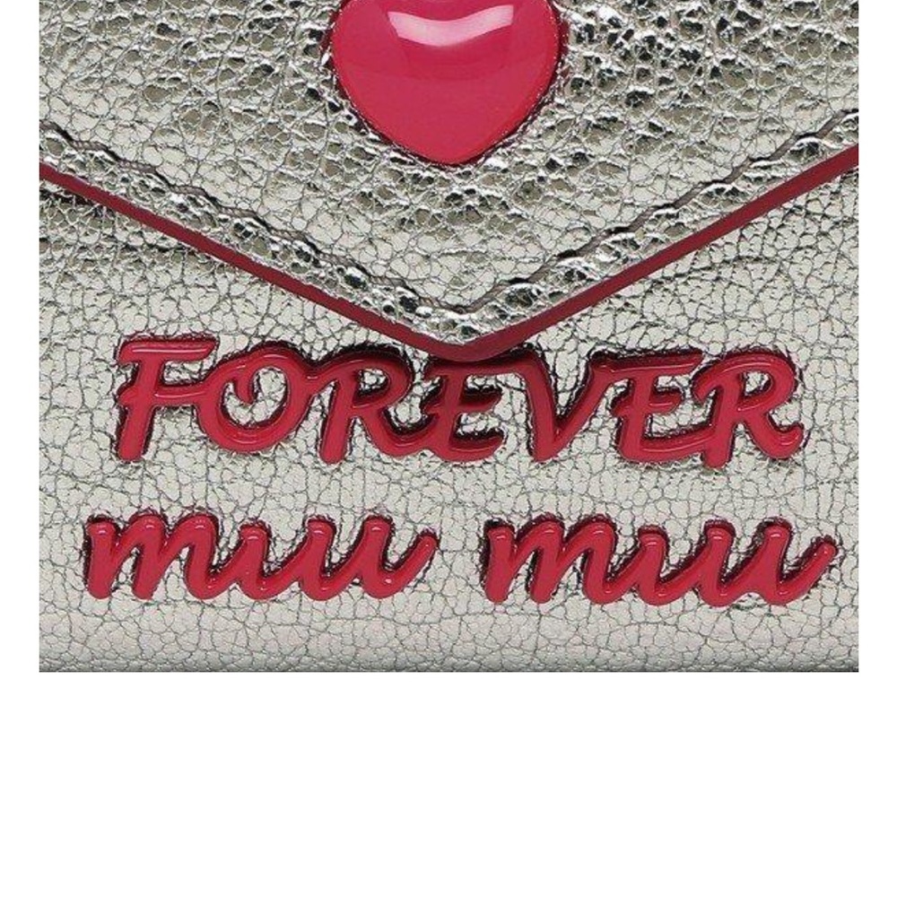 BRAND NEW NEVER USED MIU MIU SILVER METALLIC WALLET WITH FUCHSIA METALLIC TRIM.